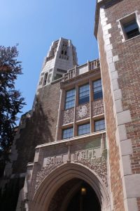 Cream colored, multi-story brick university building. Stone carved text above the entrance reads "School of Art"