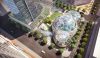 Aerial view of a large glass geodesic dome, filled with plants.