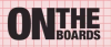 Pink and red grid background, with black text reading "On the Boards"