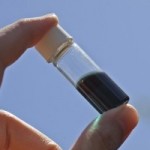 A vial holds a solution that contains the UW-developed polymer “ink” that can be printed to make solar cells.