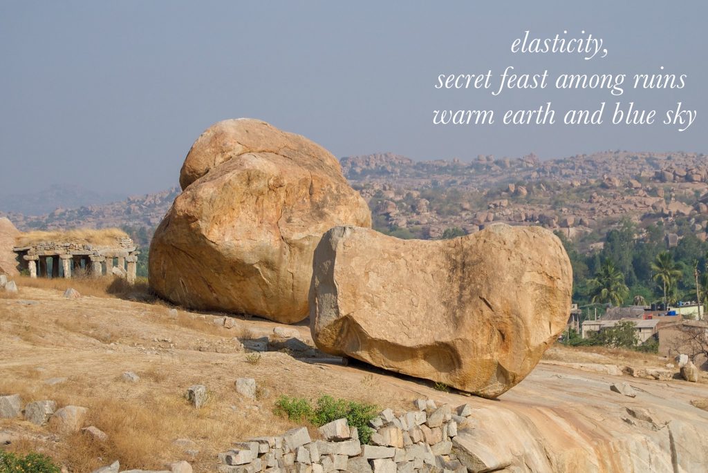 image of large boulders, with text reading: elasticity, secret feast among ruins, warm earth and blue sky