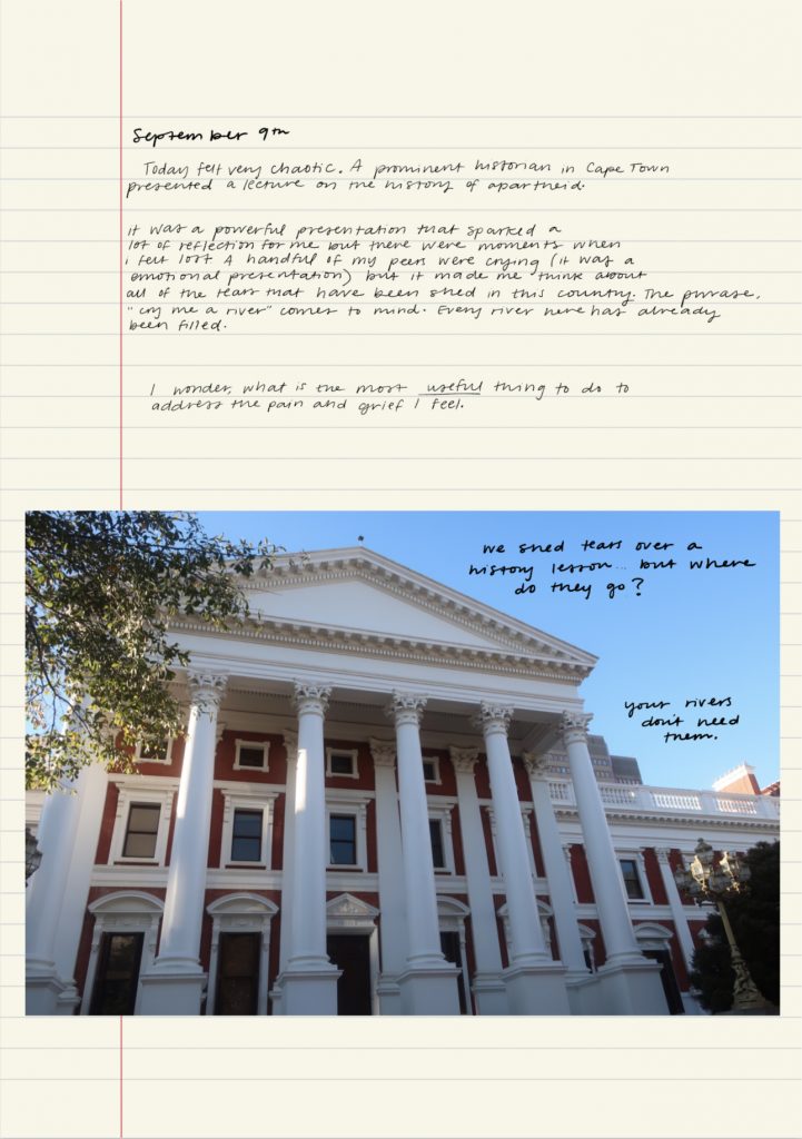 A page of a handwritten journal with a photograph of a classical building