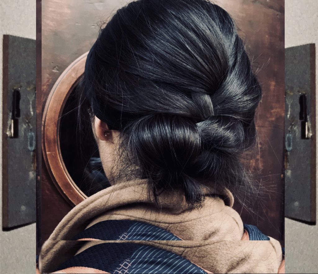 Back of woman's head with hair knotted