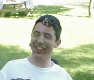 Aaron with cake all over his face