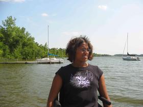 Neela's picture: on the dock with Sailboats on the lake