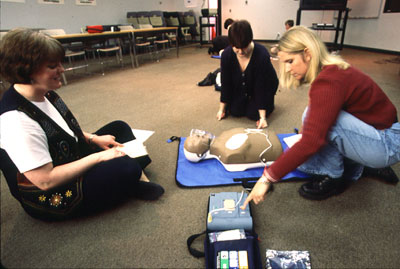 photo of women learning CPR on a dummy