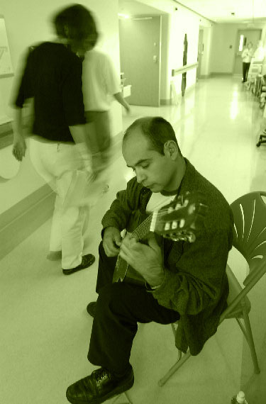 musician playing classical guitar