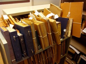 Many soft-bound materials have been stored inside cardboard "cases" (which are acidic and can cause damage in the long term)
