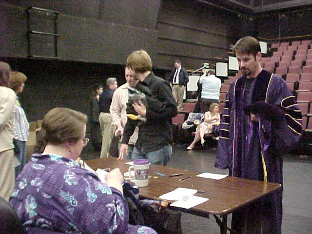 Graduates sign in.