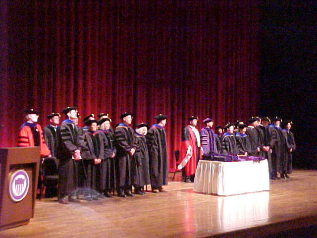 Faculy gather on stage