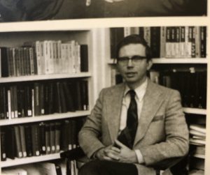 1970s photo of Ken Pyle seated in his office