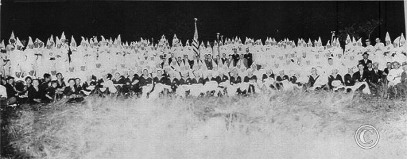 Navy Sailors holding Klan uniforms, possibly from 1923 chapter formed on the USS Tennessee. Photo: Whatcom County Historical Soc