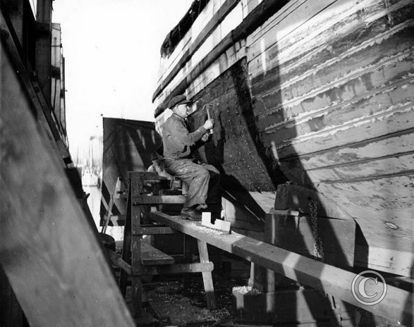 Repairing hull on ways at Salmon Bay Terminal_ Seattle_ Washington_ ca_ 1940 