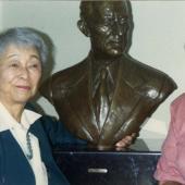 Nikki Bridges with bust of Harry Bridges in Suzzallo Library