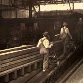 pushing cargo on the "iron stevedore," treadmill. Seattle 1927