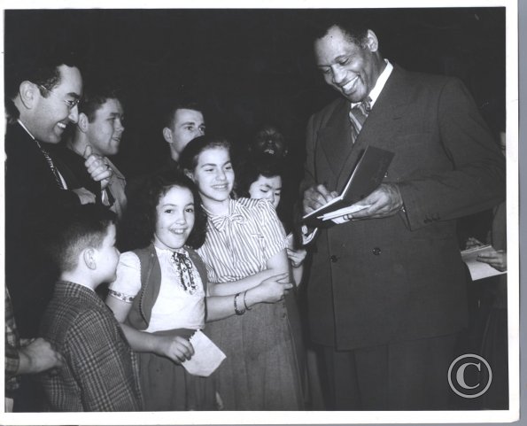 Paul Robeson giving signatures, Moore Theater 1952, Jean Cam 