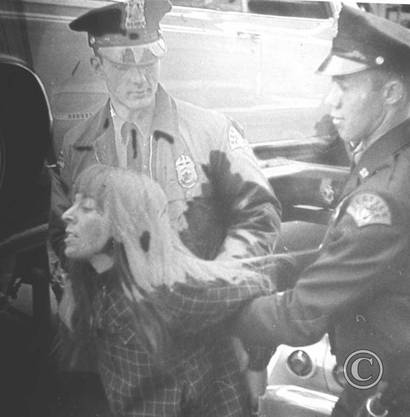 Judy Bissell being arrested during the Perfect Photo Strike, 1969.