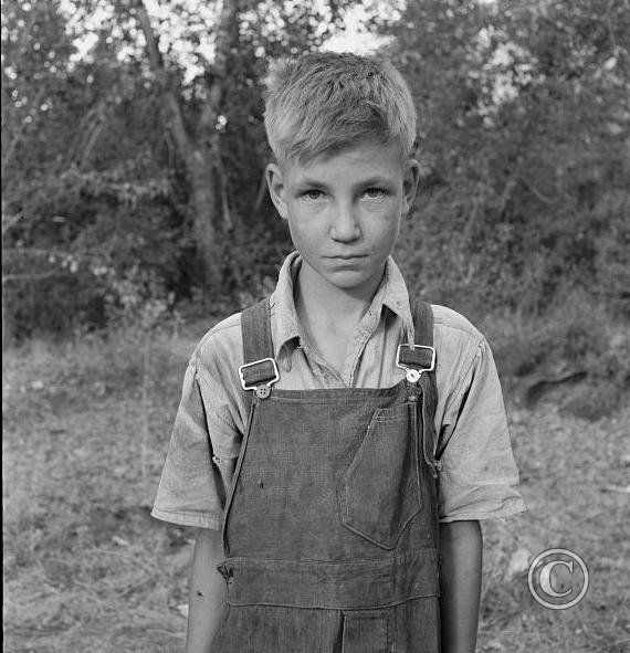 Migratory boy in squatter camp. Has come to Yakima Valley for the third year to pick hops.