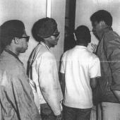 Black Panthers wait outside negotiation room