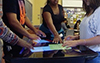 Students collaborating at a tabletop computer