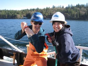 Two researchers pose for camera on deck of R/V Barnes