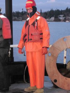 Student scientist in foul weather gear