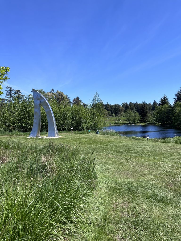 green field and a fine sculpture 