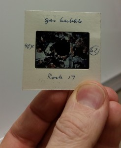 Slide of "Rock 17" thin section, front. Inscription: "gas bubble/ 40x / 62 / Rock 17"