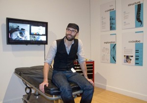 Kris Martin with his Code Blue project at the 2010 MFA exhibit at the Henry Art Gallery; photo by Mary Levin