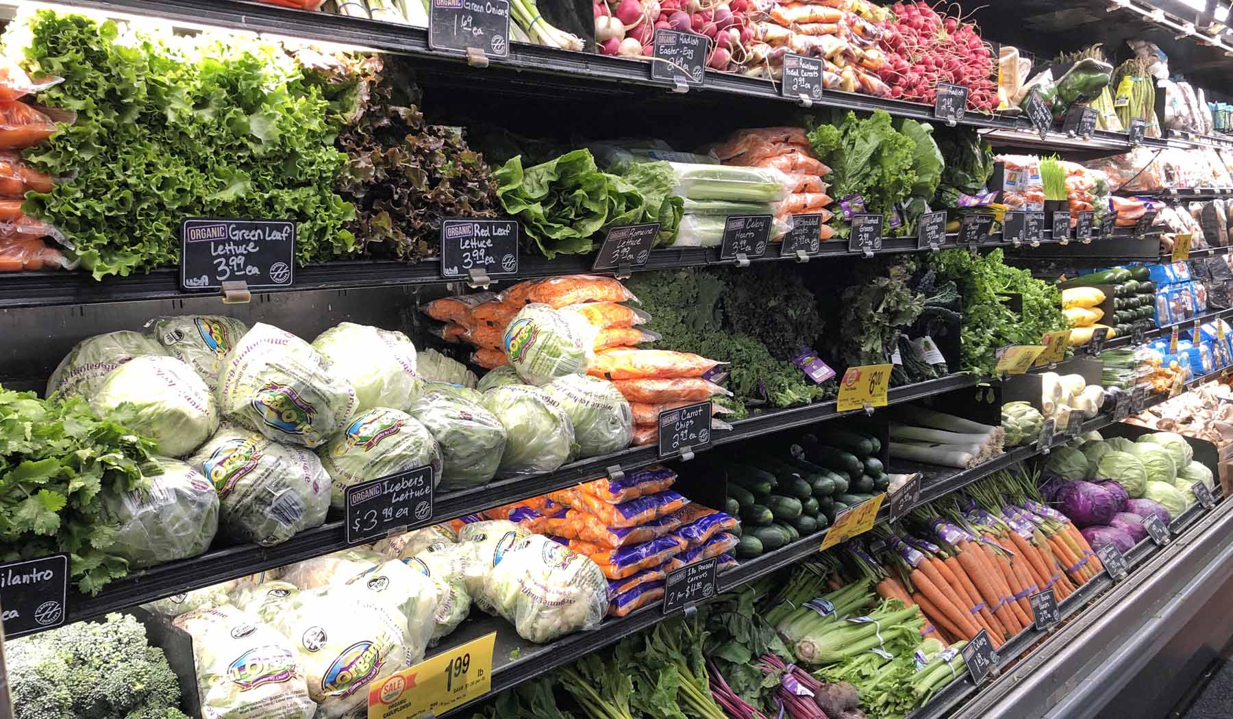 Shelves of produce in a grocery store