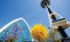 Low angle view of the Space Needle, and Chihuly glass are sculptures.