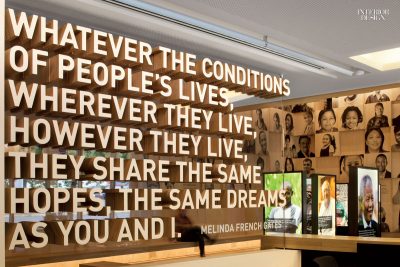 Installation of dimensional, wooden text that reads "Whatever the conditions of people's lives, wherever they live, however they live, they share the same hopes, the same dreams as you and I. Melinda French Gates."