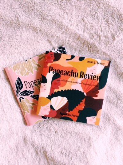 Two magazine publications rest on a soft white rug background, each titled "Papeachu Review."