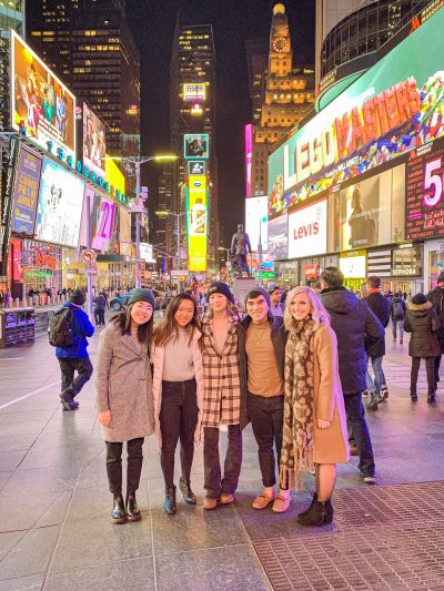 Group of students stand together in Times Square.