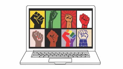 Laptop with different renderings of a raised fist illustration on the screen, including a black fist on yellow background, brown fist on black background, rainbow fist on lavender background, etc.