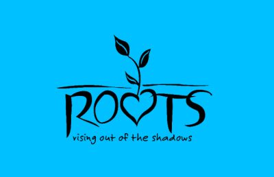 Blue background, black text that reads "Roots; rising out of the shadows." The second "O" in "Roots" is a heart shape, and has a plant growing from it.