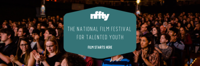 Audience in a packed theater venue applaud. A teal text box with white font reads "Nffty; The National Film Festival For Talented Youth; Film starts here."