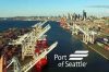 Seattle city scape with shipyard in the foreground, white text reading "Port of Seattle" over lower right corner.