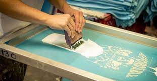 image of two hands screen printing
