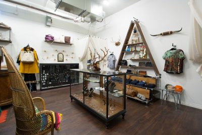 Modern shop space with jewelry and accessories in display cases and shelves.