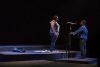Theater stage with two actors in spotlights