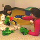 child and adult in play session