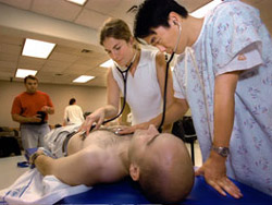 UW medical students practice physical examination skillls on each other during an Introduction to Clinical Medicine class.