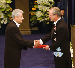 In Stockholm, Dr. Lee Hartwell (left) accepts the Nobel Prize from Swedish King Carl XVI.