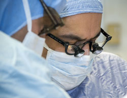 Dr. Jorge Reyes concentrates during a transplant procedure.