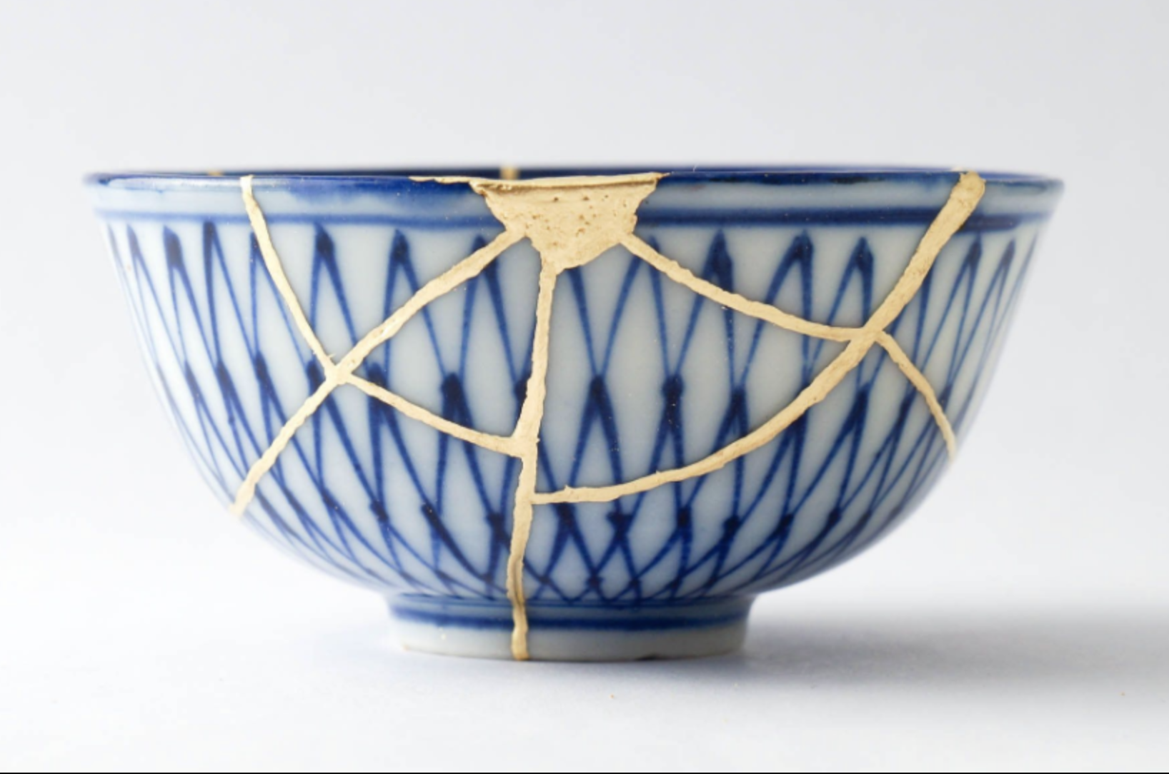 cup depicting a Japanese ceramic technique, Kintsugi