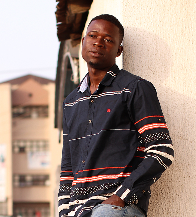 young man standing outside