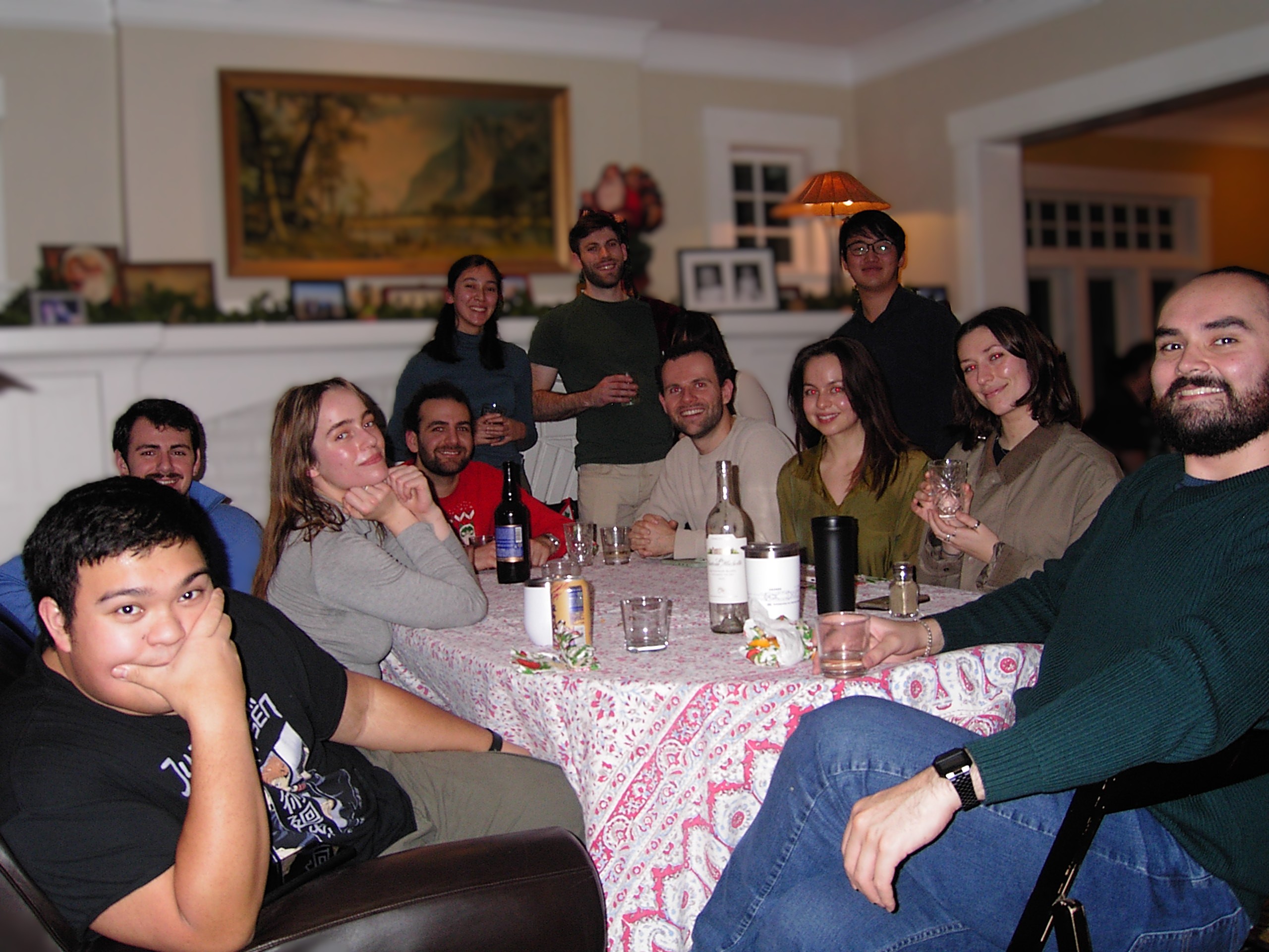 Gamelin Group members posing together with Dubs in front of a window.