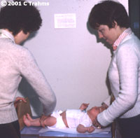 Infant being measured