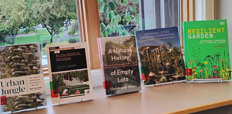 a display of books on a windowsill